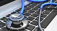 Stethoscope on a laptop keyboard